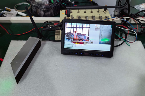 AI forklift safety monitor detecting pedestrian with red warning box and alarm alert