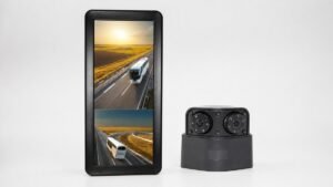Tall mirror monitor displaying two road views beside a black dual-lens vehicle camera