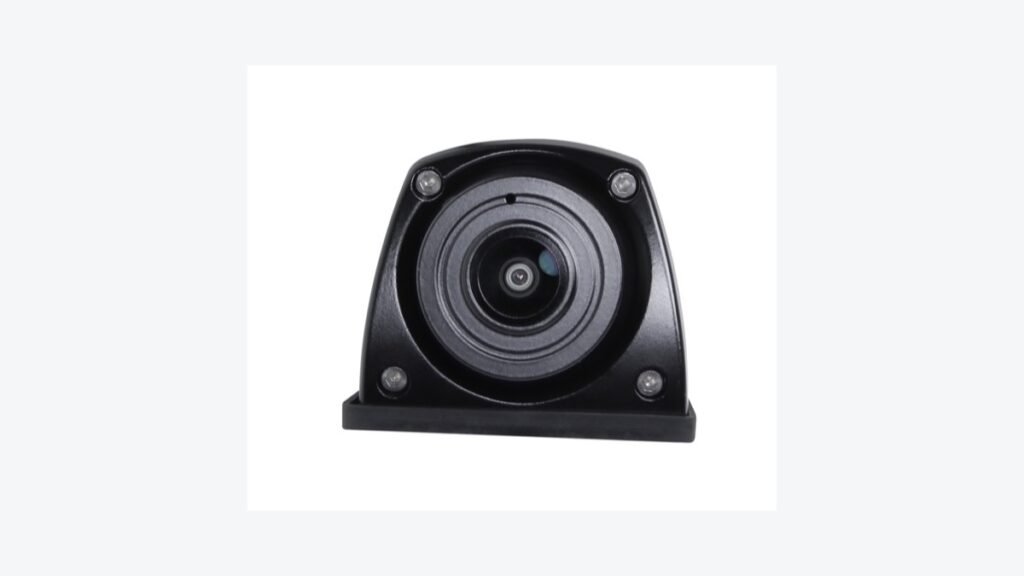 Compact black vehicle camera with a central lens and four corner fasteners on a neutral background