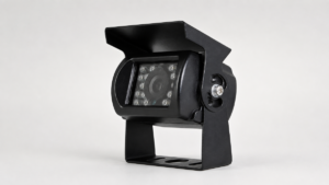 Black bracket-mounted vehicle camera with sunshield and infrared light elements on a light background