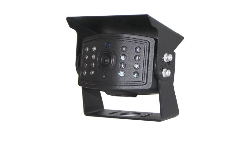 Real product photograph of a black vehicle camera with optical window, visor and mounting bracket